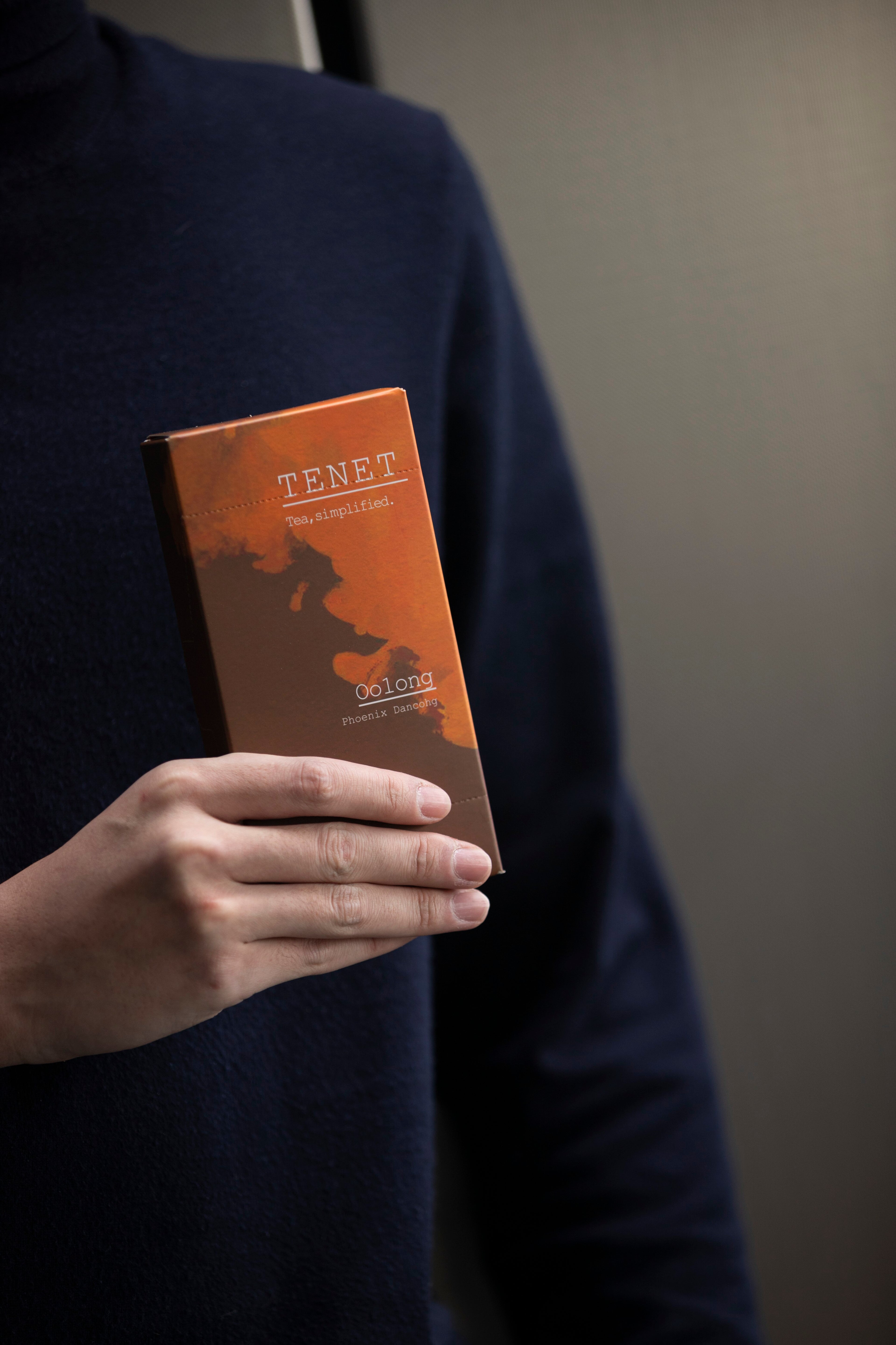 TENET freeze dried oolong tea packaging held in hand